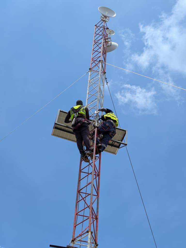 BOSCO Uganda field engineers aligning wireless links on the mast
