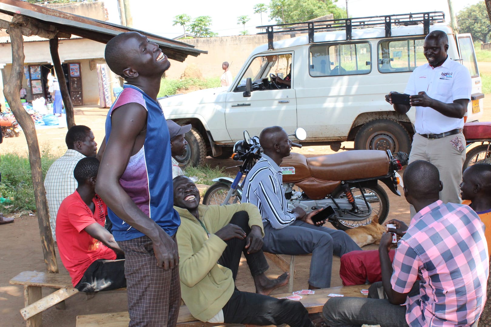 BOSCO Uganda staff enage community members in Rakoko, Pader district