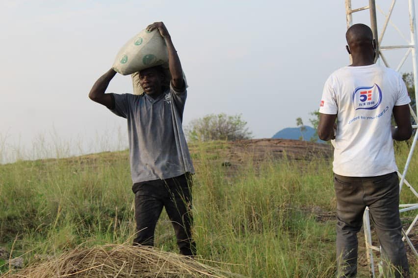 A community member provides manual labour during a recent tower construction in Latanya