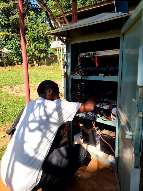 Opoya Benjamin during field checks on network equipment